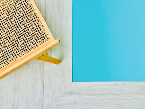 a wooden bench sitting on the side of a wall at Canaryislandshost l Boya Suites in Playa Honda