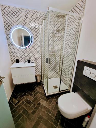 a bathroom with a shower and a toilet and a sink at 2 Appt MédiéLounge ou MédiéOld, Parking Vue magnifique par Beds76 in Rouen