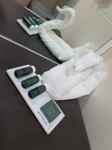 a hand in a white towel on a table at Hotel Vila Raia in Idanha-a-Nova