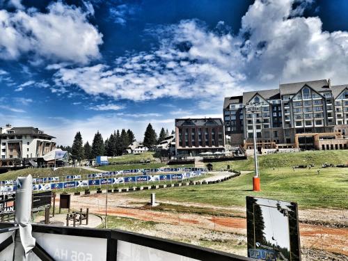a view of a campus with a train yard and buildings at Milmari S70 Kopaonik in Kopaonik