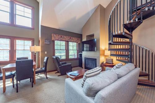 a living room with a couch and a table at A308 Studio & Loft Standard View in Oakland
