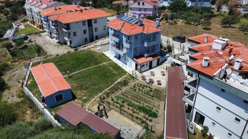 an aerial view of a large house with red roofs at Parli Hotel in Gokceada Town