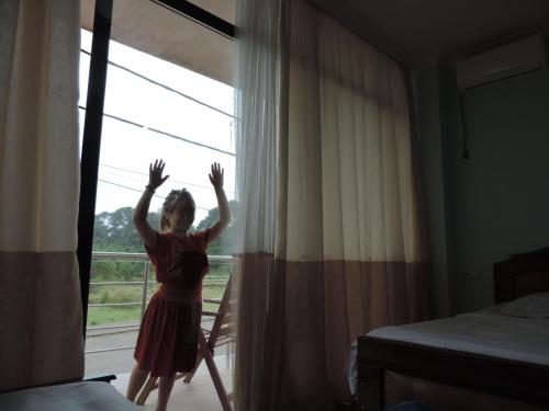 a little girl standing in front of a window at LUKA in K'obulet'i