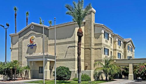 a large building with a clock on the front of it at Comfort Inn West Phoenix at 27th Ave and I-I0 in Phoenix