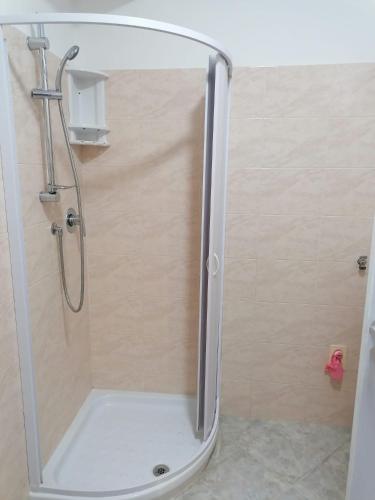 a shower with a glass door in a bathroom at L'Alba in Tropea