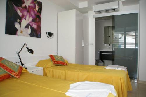 Katil atau katil-katil dalam bilik di Apartamentos Centremar