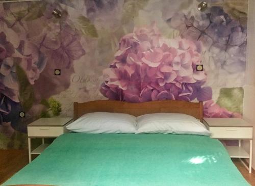 Tempat tidur dalam kamar di Villa Millefiori - Apartments Mali Lošinj