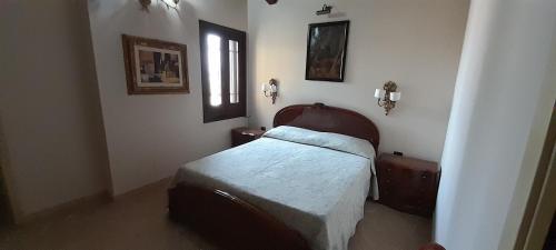 سرير أو أسرّة في غرفة في Casa vacanze Monterosso