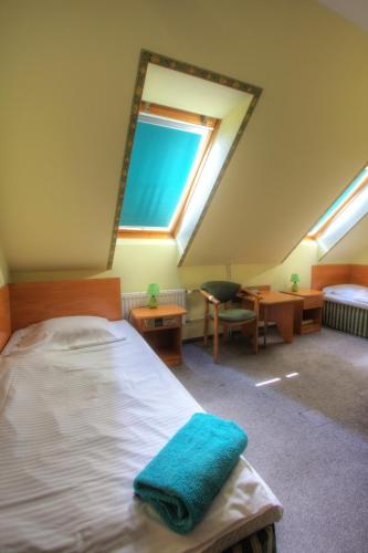 Ein Bett oder Betten in einem Zimmer der Unterkunft Hotel Margo
