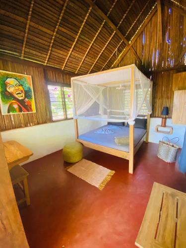 Letto o letti in una camera di Tamarin Lodge