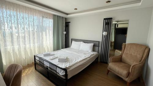Postel nebo postele na pokoji v ubytování Ora Bella Hotel