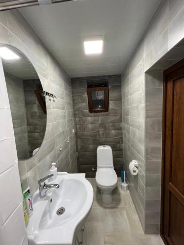 a bathroom with a sink and a toilet at Seva Guesthouse and Cottages Byurakan in Byurakan
