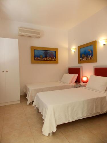 Postel nebo postele na pokoji v ubytování Skiathos Driades