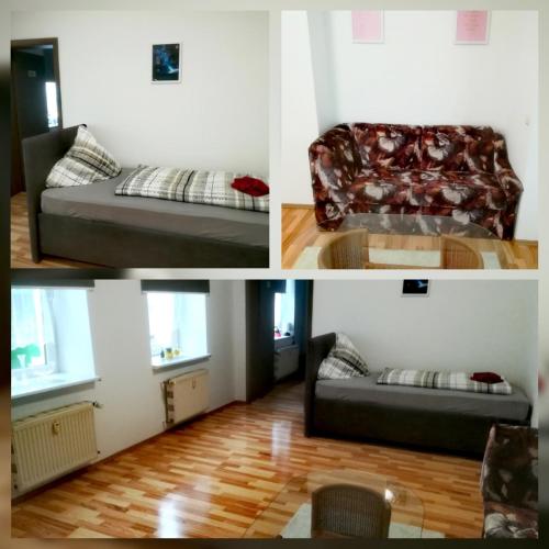 a room with a bed and a couch and a chair at Ferienwohnung Axel - nahe Chemnitz in Limbach - Oberfrohna