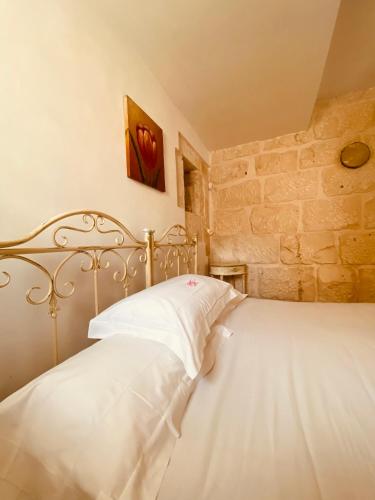 Postel nebo postele na pokoji v ubytování Mastro Vanni - Urban Masseria