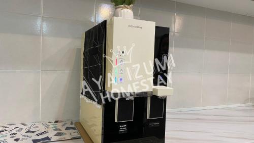a black and white refrigerator in a room at Aya Izumi 3 bed Condo near to Bangi Wonderland in Kajang