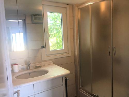 a bathroom with a sink and a shower at Home on Iznik Lake with its own Private Beach in Bursa