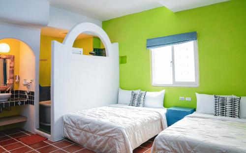 Postel nebo postele na pokoji v ubytování Bethlehem B&B Kenting