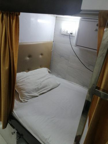 Krevet ili kreveti u jedinici u objektu Andheri-69-Dormitory