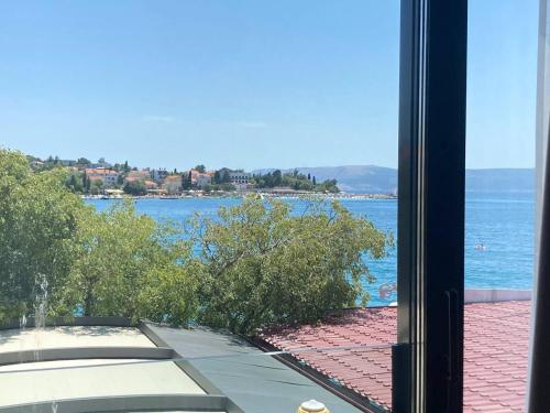 a view of the water from a window at Hotel Millenium deluxe in Selce