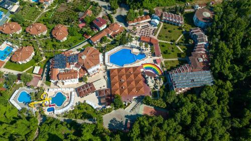 an overhead view of a mansion with a pool at Lykia Botanika Beach Fun & Club - All Inclusive in Fethiye