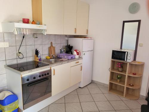 Kuchyň nebo kuchyňský kout v ubytování Apartments Mašić
