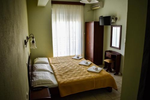 מיטה או מיטות בחדר ב-Tsipos Rooms