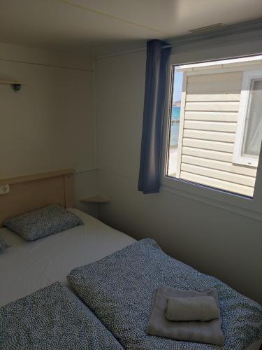 Posteľ alebo postele v izbe v ubytovaní K9 Mobile Home Camp Imperial Vodice