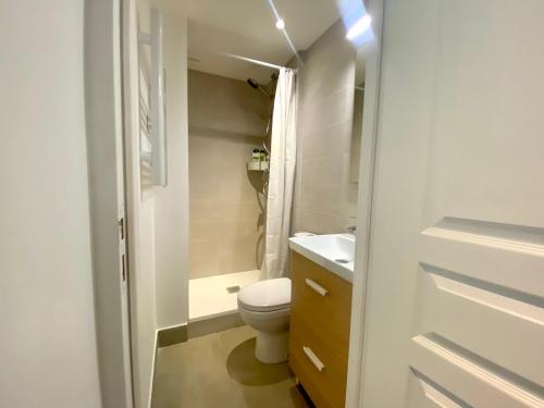 a small bathroom with a toilet and a sink at Home Sweet Home Batignolles in Paris