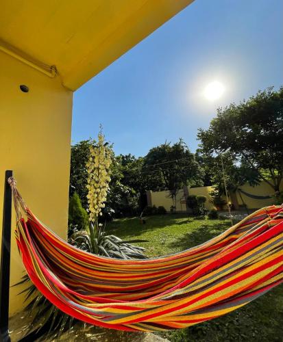 a hammock hanging on the side of a building at Guest House Kobuleti in K'obulet'i