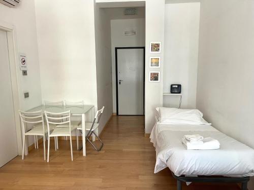 Ένα ή περισσότερα κρεβάτια σε δωμάτιο στο Luciano Laterani Guest House