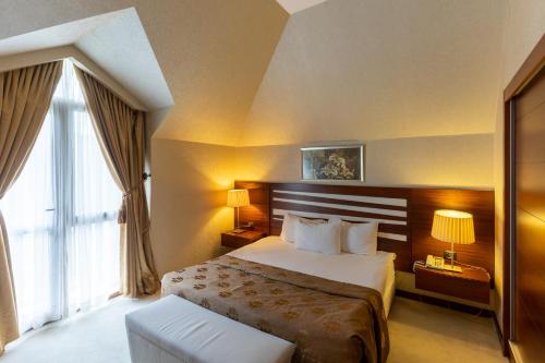 Giường trong phòng chung tại Qafqaz Resort Hotel