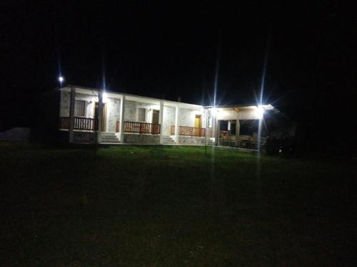 a house at night with two lights on it at Buni Shqipes in Theth