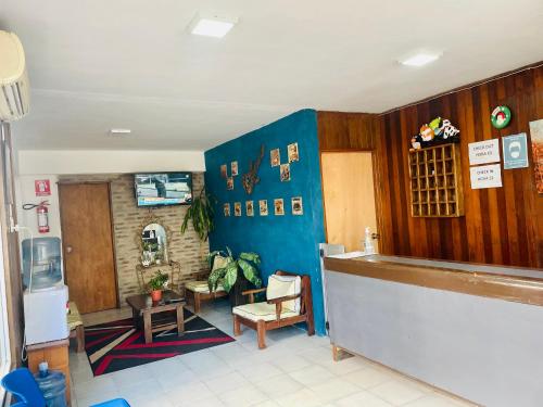 a restaurant with a counter in a room at Las Palmas del Daymán in Termas del Daymán