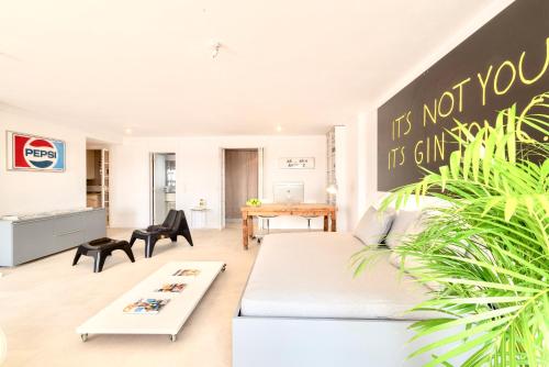 a living room with a couch and a table at Lisbon Swimming pool apartment with private parking in Lisbon