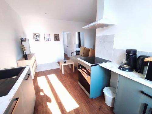 a kitchen with a sink and a counter top at Appartement hyper centre de Montargis in Montargis