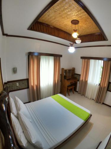 Postel nebo postele na pokoji v ubytování El Nido Viewdeck Cottages