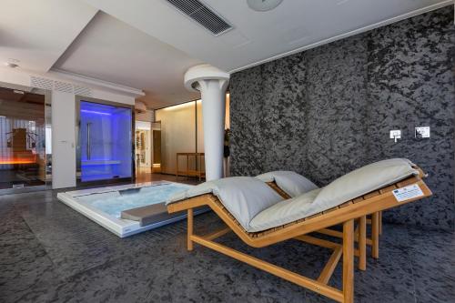 a bedroom with a bed and a swimming pool at Luxury B&B Villetta Carra City - Gallipoli in Gallipoli