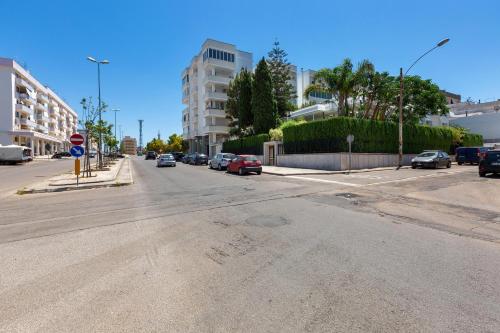 an empty street with cars parked on the road at Luxury B&B Villetta Carra City - Gallipoli in Gallipoli