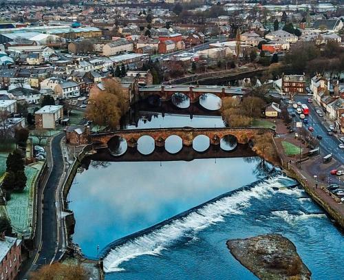 an aerial view of a bridge over a river at Mid Flat in Dumfries