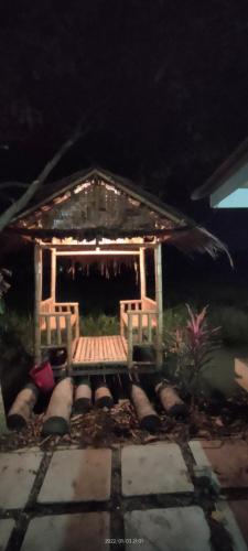 a gazebo with a bench in front of it at Bungalow Mat Hj Limah in Alor Setar