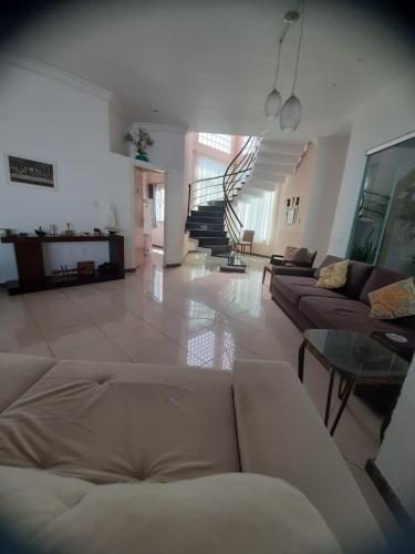 a living room with a couch and a table at Pousada do Bosque in Rio Branco