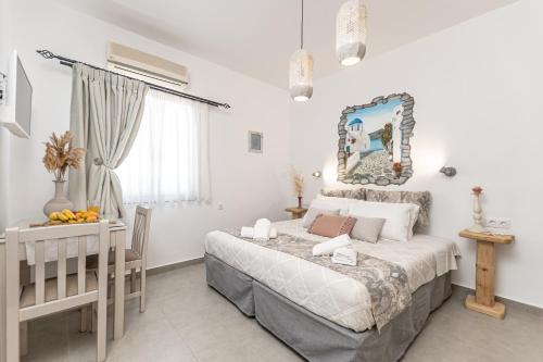 a bedroom with a bed and a crib in a room at Arhontiko in Naxos Chora