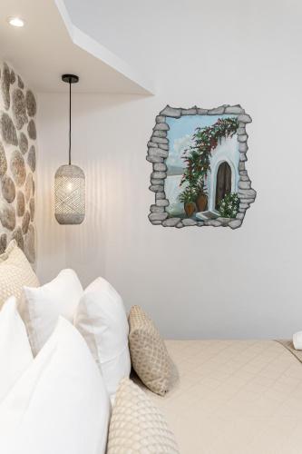 a bedroom with a bed and a mirror on the wall at Arhontiko in Naxos Chora