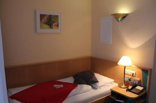 Katil atau katil-katil dalam bilik di Hotel an der Stadtmauer