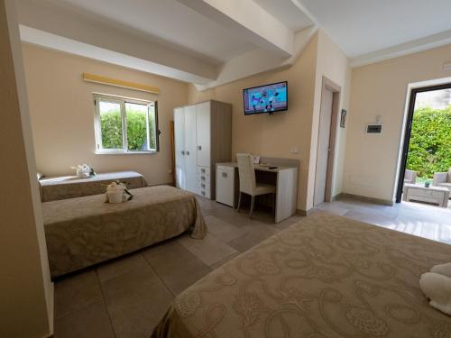 Cama o camas de una habitación en B&B Villa Lisa