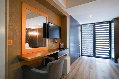 A television and/or entertainment centre at Time Hotel Mecidiyekoy