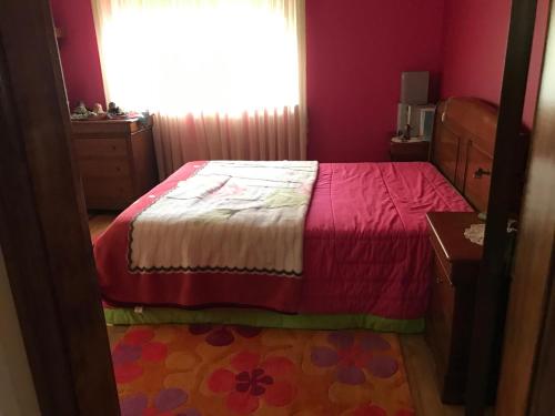 a bedroom with a bed and a window at Moradia Com Piscina T4 in Esposende