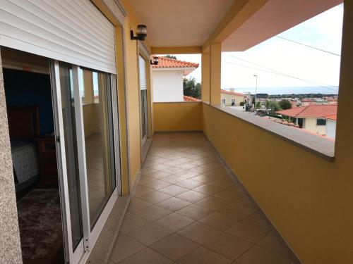 a balcony of a house with a walkway at Moradia Com Piscina T4 in Esposende