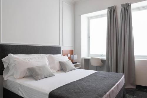Posteľ alebo postele v izbe v ubytovaní Domus Prestige -Suite Repubblica- In Central Rome